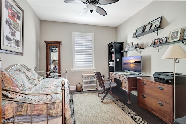 bedroom with wood-type flooring and ceiling fan