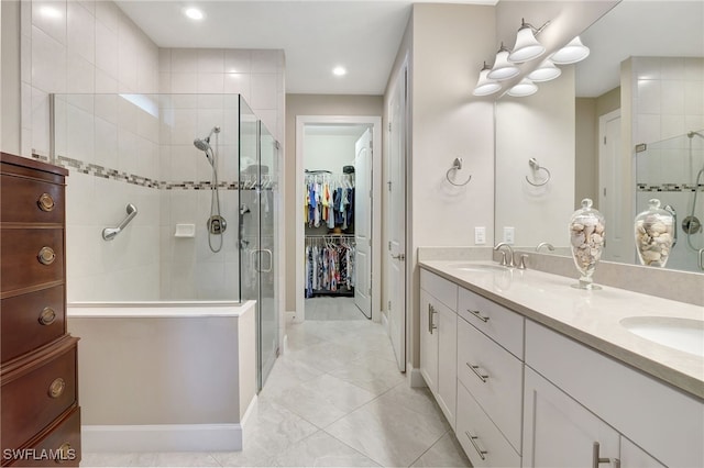 bathroom with vanity and an enclosed shower