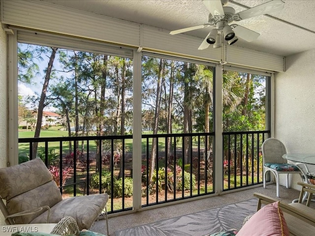 sunroom / solarium with ceiling fan