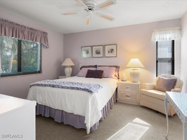 bedroom with light carpet and ceiling fan