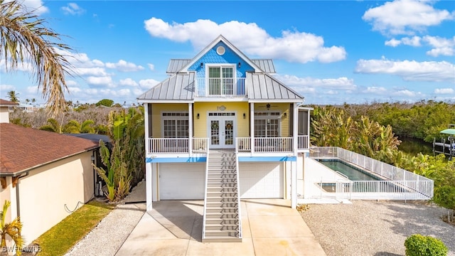 exterior space with a garage and french doors