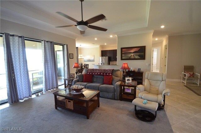 tiled living room featuring ceiling fan and ornamental molding