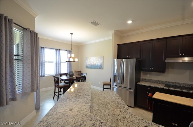 kitchen featuring light stone countertops, crown molding, light tile patterned floors, decorative light fixtures, and stainless steel fridge with ice dispenser