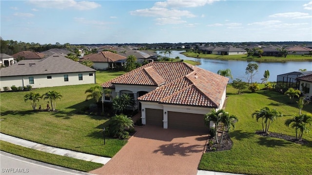 birds eye view of property with a water view