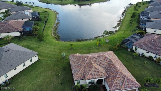 drone / aerial view with a water view