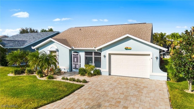 ranch-style house featuring a garage and a front yard