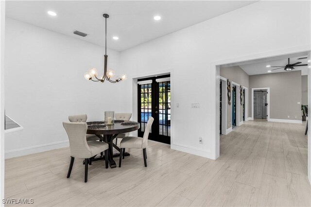 dining room with light wood-type flooring and baseboards