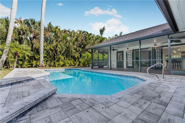 pool with ceiling fan and a patio