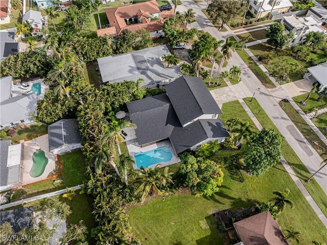 birds eye view of property with a residential view