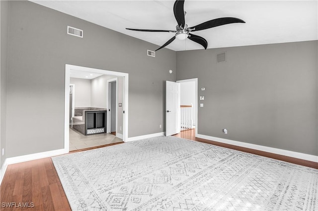 unfurnished bedroom featuring light wood finished floors, baseboards, and visible vents