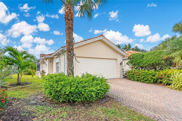 view of property exterior with a garage