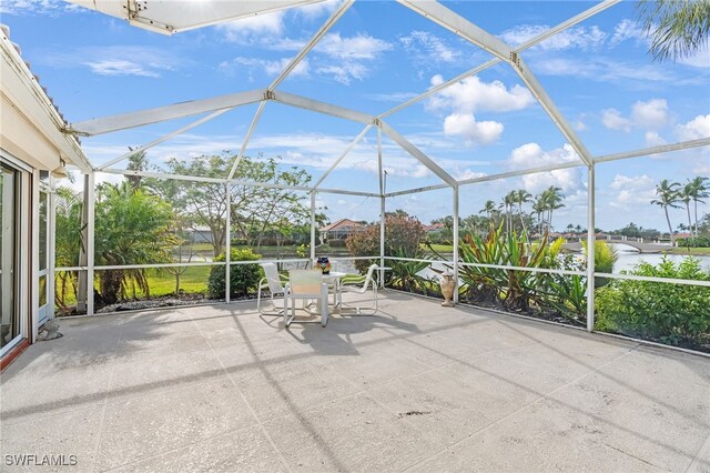 view of patio / terrace featuring a lanai