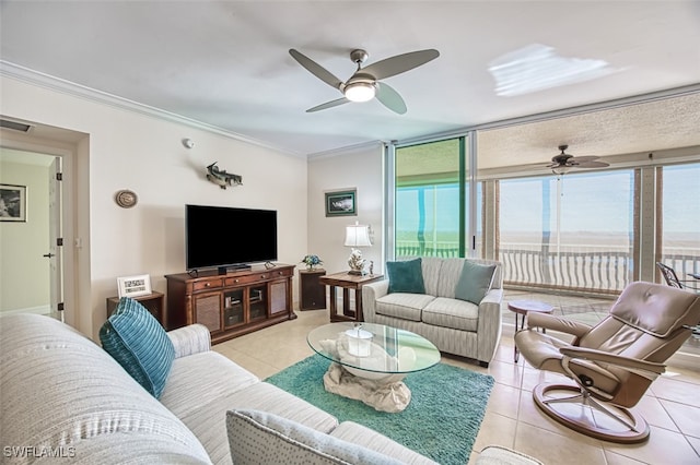 tiled living room featuring ceiling fan and crown molding