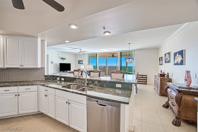 kitchen with white cabinets, dishwasher, kitchen peninsula, and sink