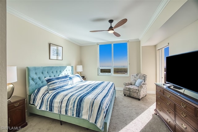 carpeted bedroom featuring ceiling fan, ornamental molding, and multiple windows