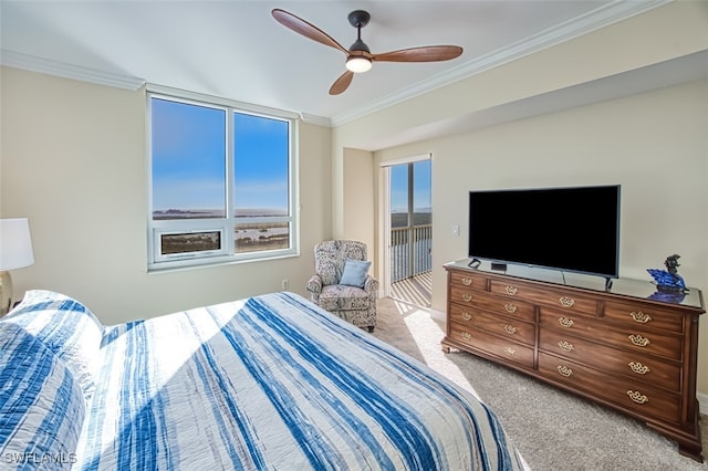 carpeted bedroom with ceiling fan and ornamental molding