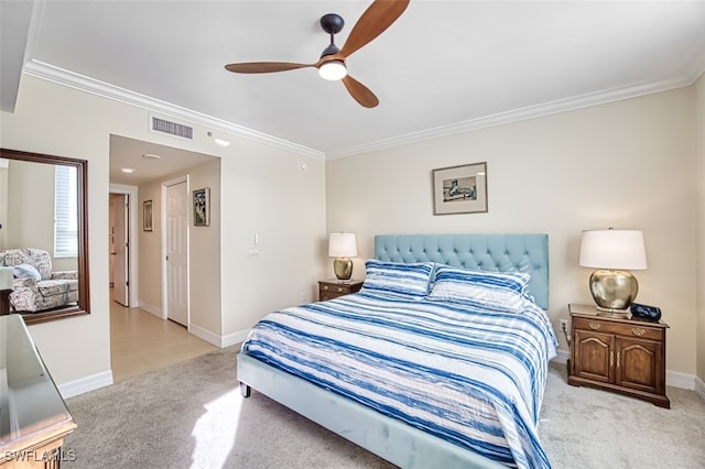 carpeted bedroom with ceiling fan and crown molding