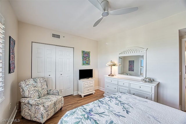 bedroom featuring hardwood / wood-style flooring, a closet, and ceiling fan