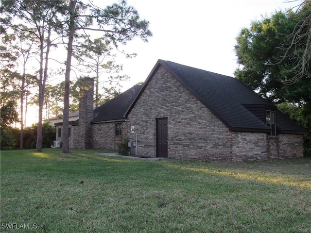 view of home's exterior with a lawn