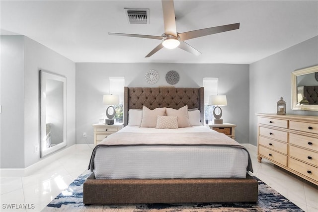 bedroom with visible vents, ceiling fan, baseboards, and light tile patterned flooring