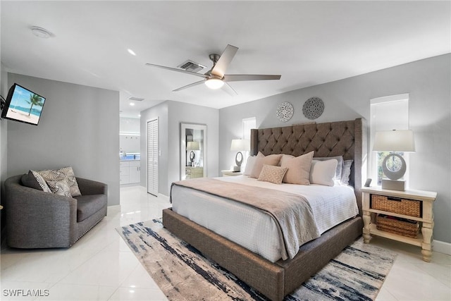 bedroom featuring visible vents, a ceiling fan, connected bathroom, multiple windows, and baseboards