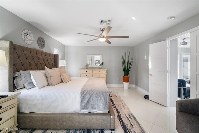 tiled bedroom featuring ceiling fan and multiple windows