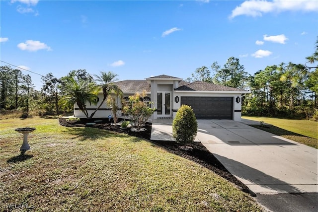 view of front of house featuring french doors, a garage, and a front lawn