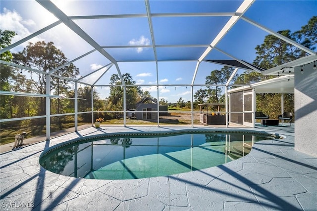 view of pool with a lanai and a patio area