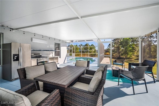 view of patio / terrace featuring an outdoor pool, an outdoor kitchen, glass enclosure, an outdoor hangout area, and outdoor dining area