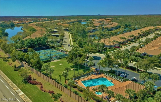 birds eye view of property with a water view