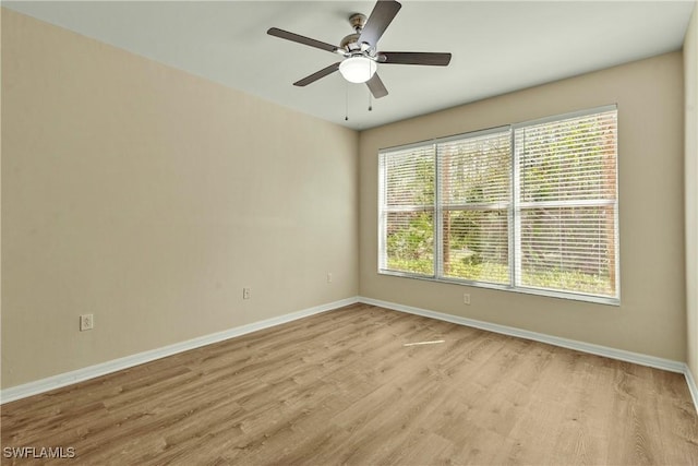 empty room featuring ceiling fan and light wood-type flooring