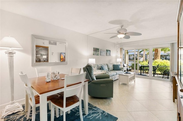 living room with ceiling fan and light tile patterned flooring