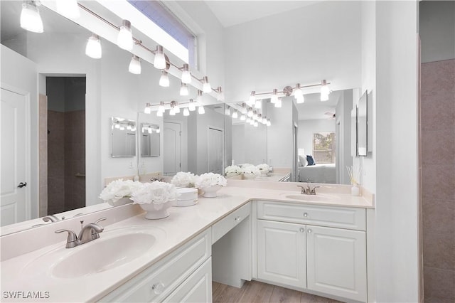 bathroom with hardwood / wood-style floors and vanity