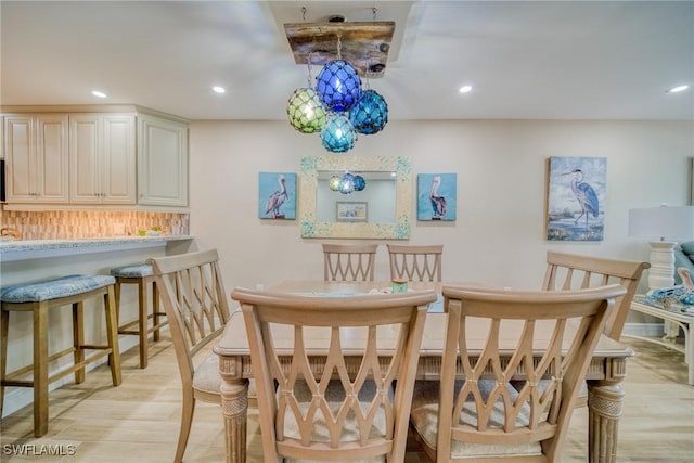 dining room with light hardwood / wood-style flooring