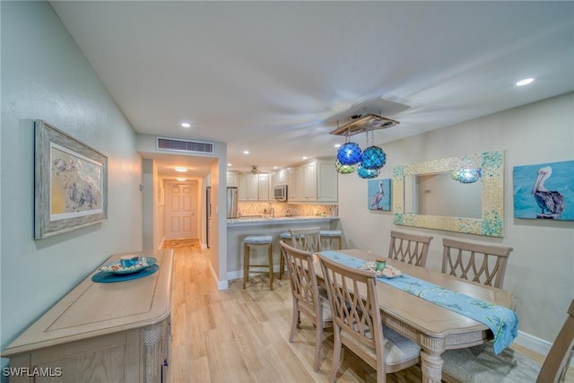 dining room featuring light hardwood / wood-style flooring