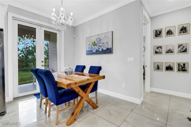 dining room with crown molding and a chandelier