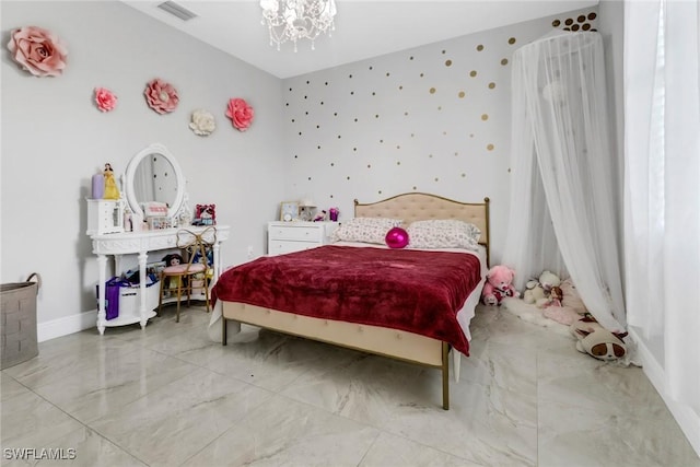 bedroom with a notable chandelier