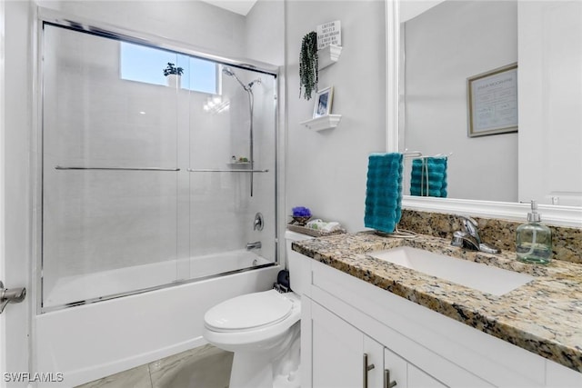 full bathroom featuring vanity, toilet, and enclosed tub / shower combo