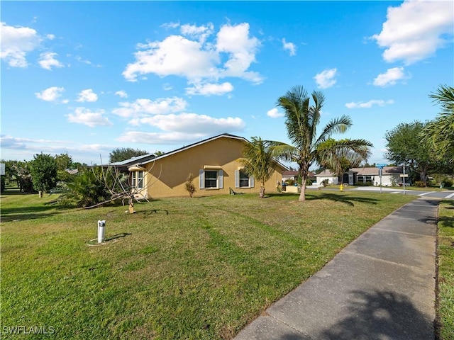 view of front of home with a front yard