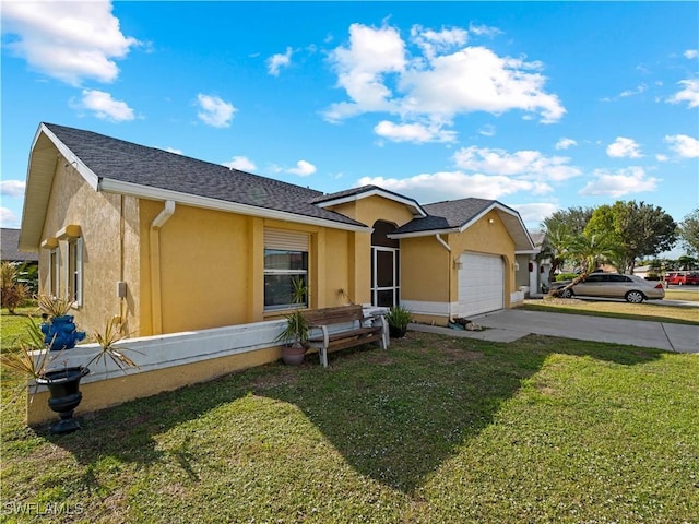 view of front facade with a garage and a front lawn