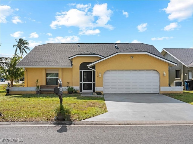 ranch-style house featuring a garage and a front lawn