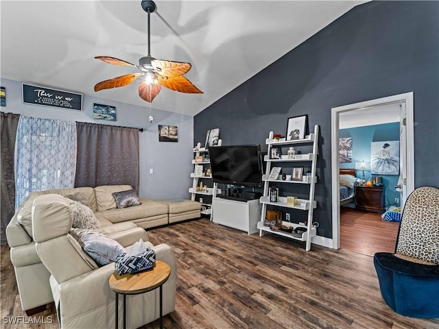 living room featuring vaulted ceiling, ceiling fan, and dark hardwood / wood-style floors