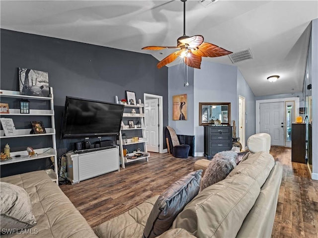 living room featuring hardwood / wood-style flooring, ceiling fan, and lofted ceiling