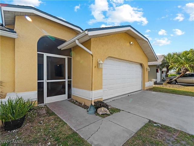 view of side of property featuring a garage