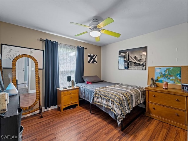 bedroom with hardwood / wood-style floors and ceiling fan