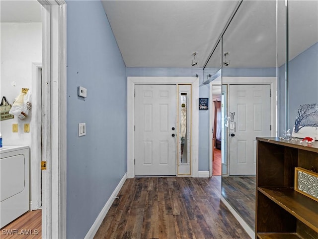 entryway with washer / clothes dryer and dark wood-type flooring