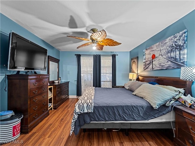 bedroom featuring ceiling fan and wood-type flooring