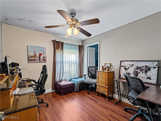 office area with dark hardwood / wood-style floors and ceiling fan