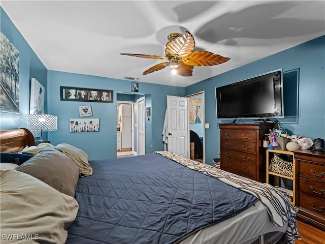 bedroom featuring hardwood / wood-style floors and ceiling fan