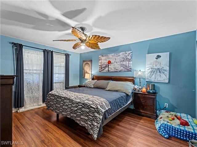 bedroom with ceiling fan and hardwood / wood-style flooring